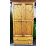 A two door pine wardrobe, W. 96cm. H. 197cm.