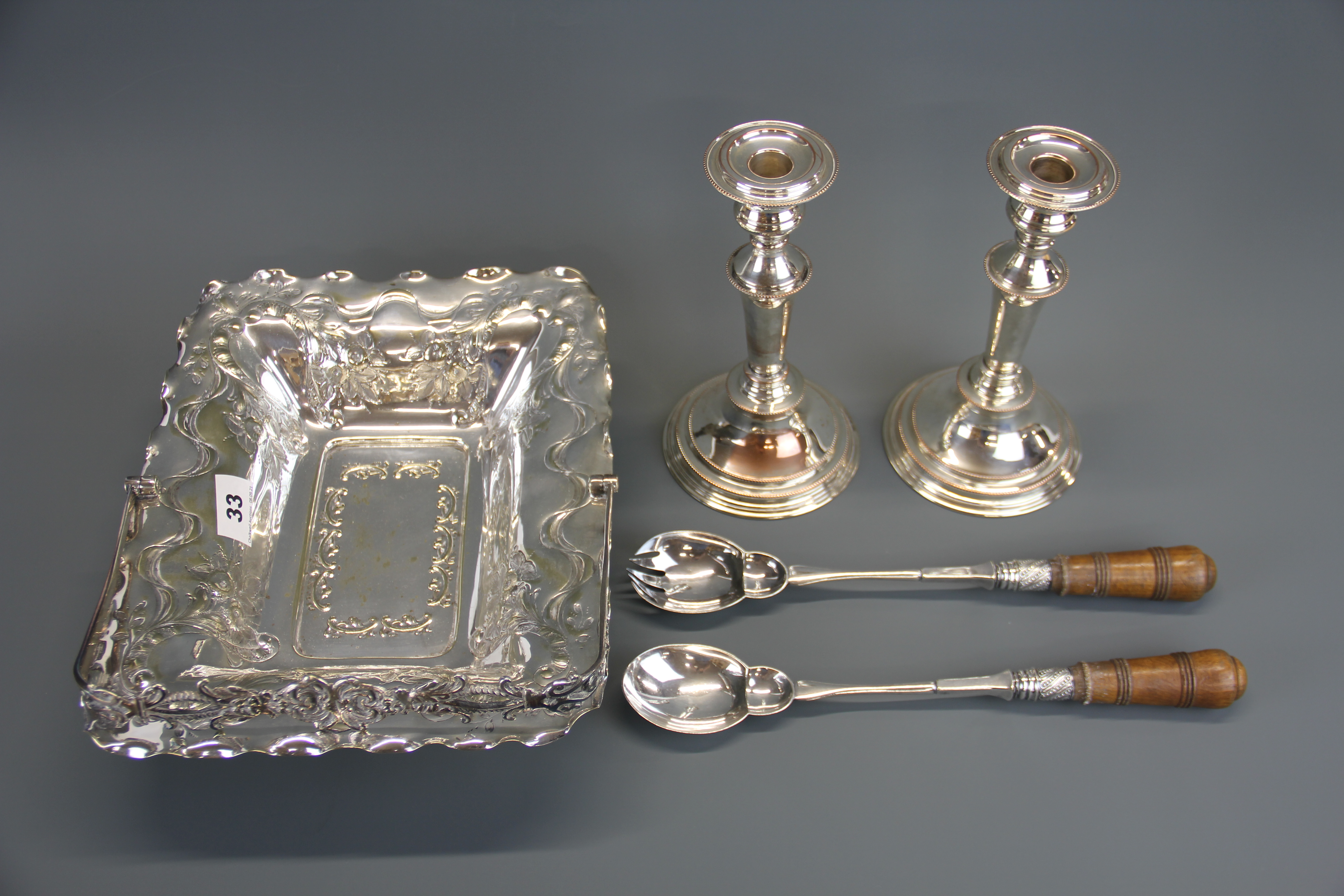 A Victorian hammered silver plated fruit basket with a pair of salad servers and a pair of silver