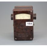 A leather cased green bakelite Megger continuity and polarity testing gauge. Together with a brown