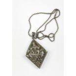A heavy Indian white metal (tested silver) deity locket, L. 7.5cm. with a 925 silver chain.