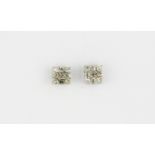 A pair of 9ct yellow gold diamond set stud earrings, L. 0.5cm.