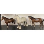 Three Beswick horse figures.