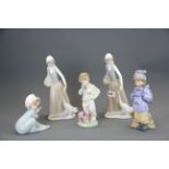 A group of five Nao porcelain figurines, tallest 24cm.