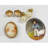 A silver gilt mounted cameo brooch, earrings and hand painted porcelain miniature.