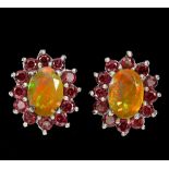 A pair of 925 silver cluster earrings set with oval cut opals surrounded by garnets, L. 1.2cm.