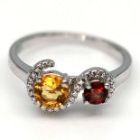 A matching 925 silver ring set with garnet and citrines, (R).