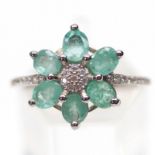 A 925 silver emerald and white stone set cluster ring, (R).
