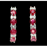 A pair of 925 silver hoop earrings set with rubies and white stones, L. 2.5cm.