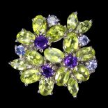 A 925 silver flowere shaped ring set with oval cut peridots, tanzanites and amethysts, (P).