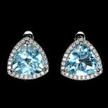 A pair of f925 silver earrings set with large trillion cut blue topaz and white stones, L. 1.1cm.