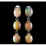 A pair of 925 silver drop earrings set with large cabochon cut opals, L. 3.7cm.