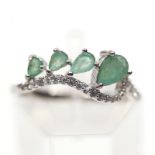 A 925 silver ring set with pear cut emeralds and white stones, (P.5).