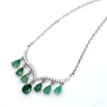 A 925 silver necklace set with pear cut emeralds and white stones, L. 42cm.