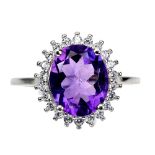 A matching 925 silver ring set with an oval cut amethyst and white stones, (O).