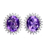 A pair of 925 silver cluster earrings set with oval cut amethysts surrounded by white stones, L. 1.