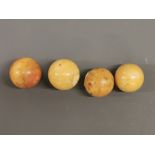 Four antique ivory billiard balls, Dia. 4.5cm.