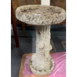 A vintage concrete garden bird bath, H. 66cm.