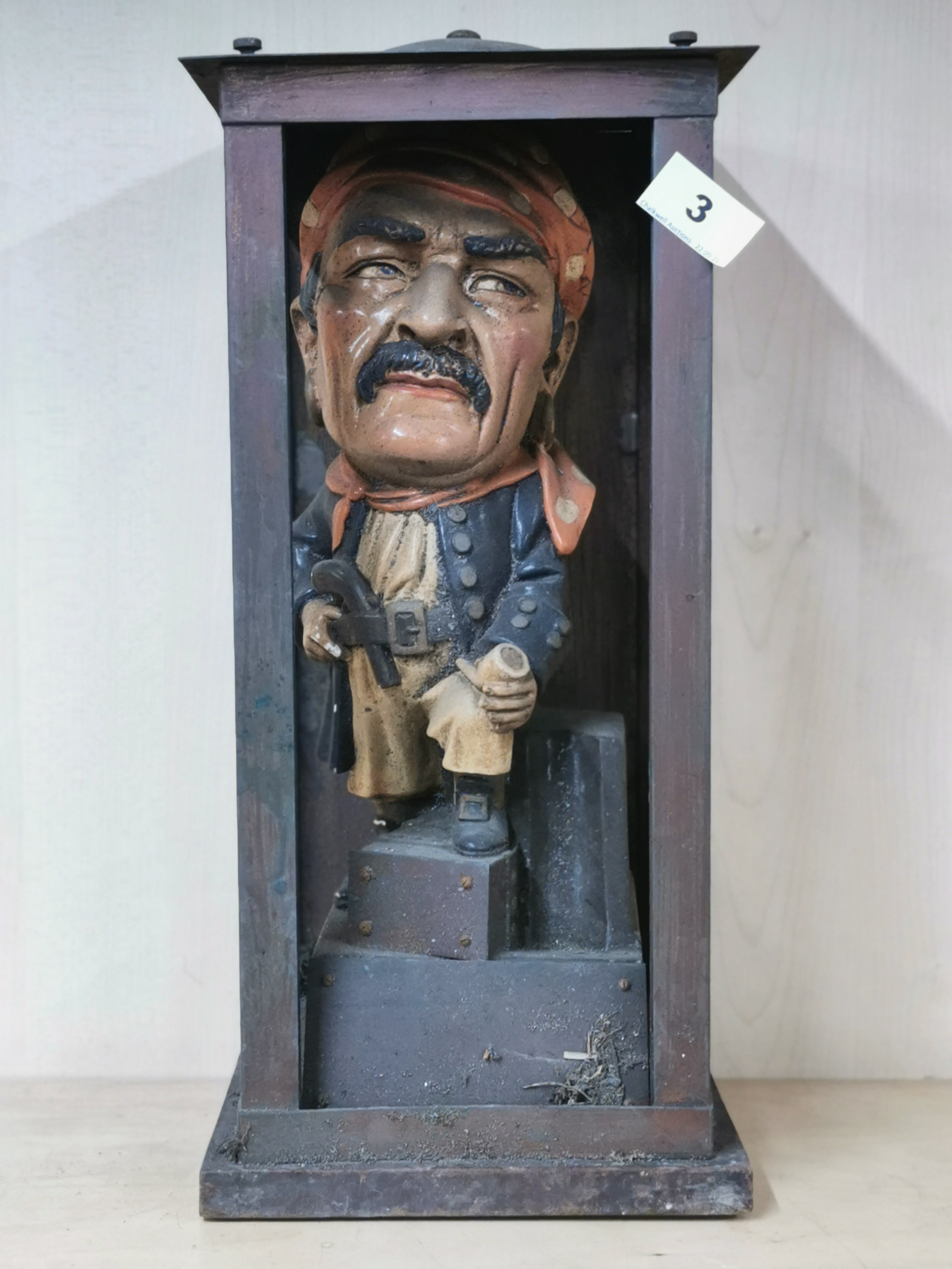 An interesting vintage painted ceramic figure of a pirate in a handmade copper case, H. 43cm.