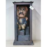 An interesting vintage painted ceramic figure of a pirate in a handmade copper case, H. 43cm.