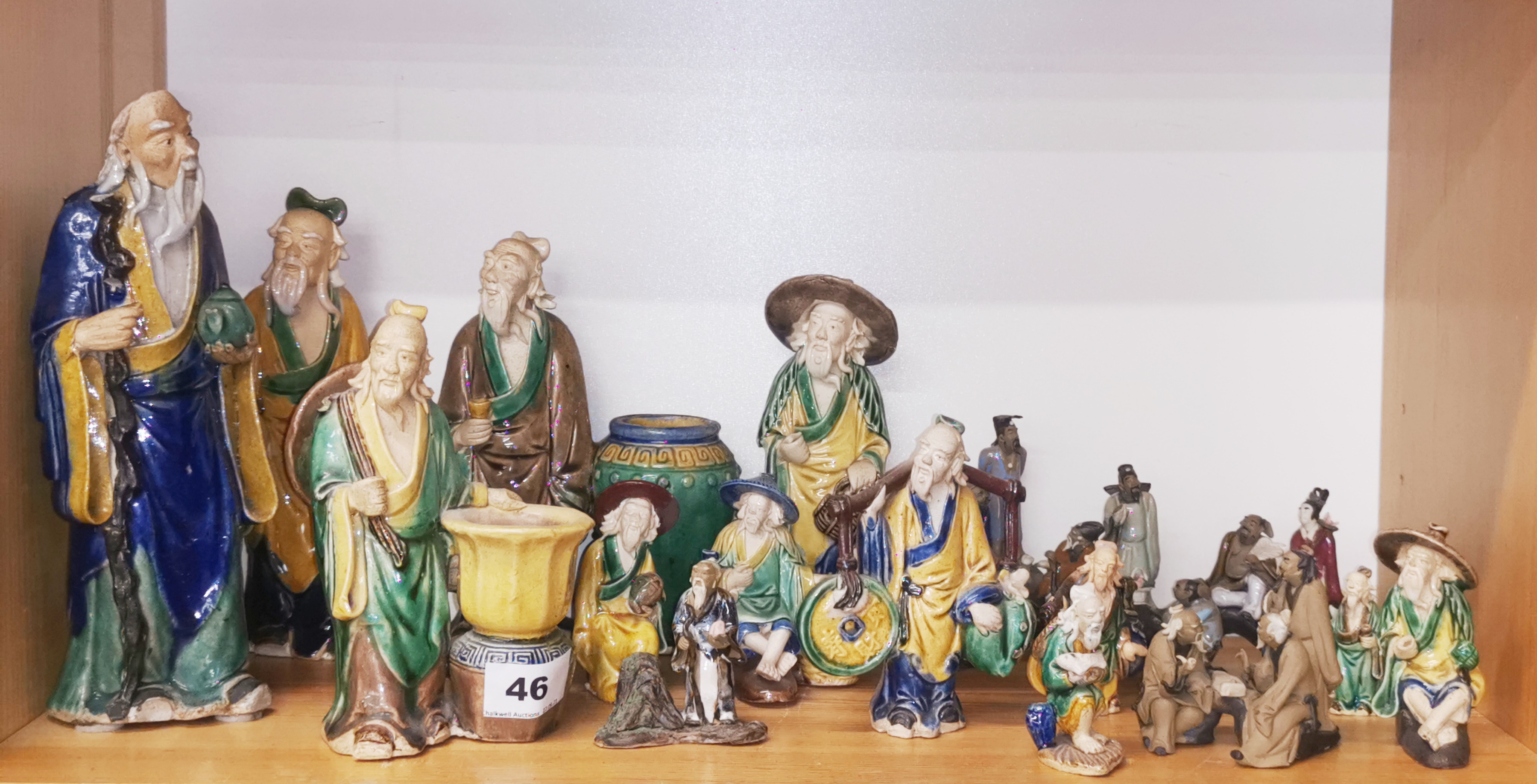 A group of Chinese glazed pottery figures, tallest 24cm.