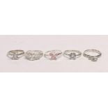 Five mixed silver rings