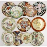 A group of Oriental design wall plates.