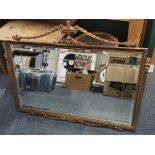 A 1950's gilt wall mirror, frame size 98 x 77cm.