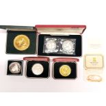 A group of commemorative coins.