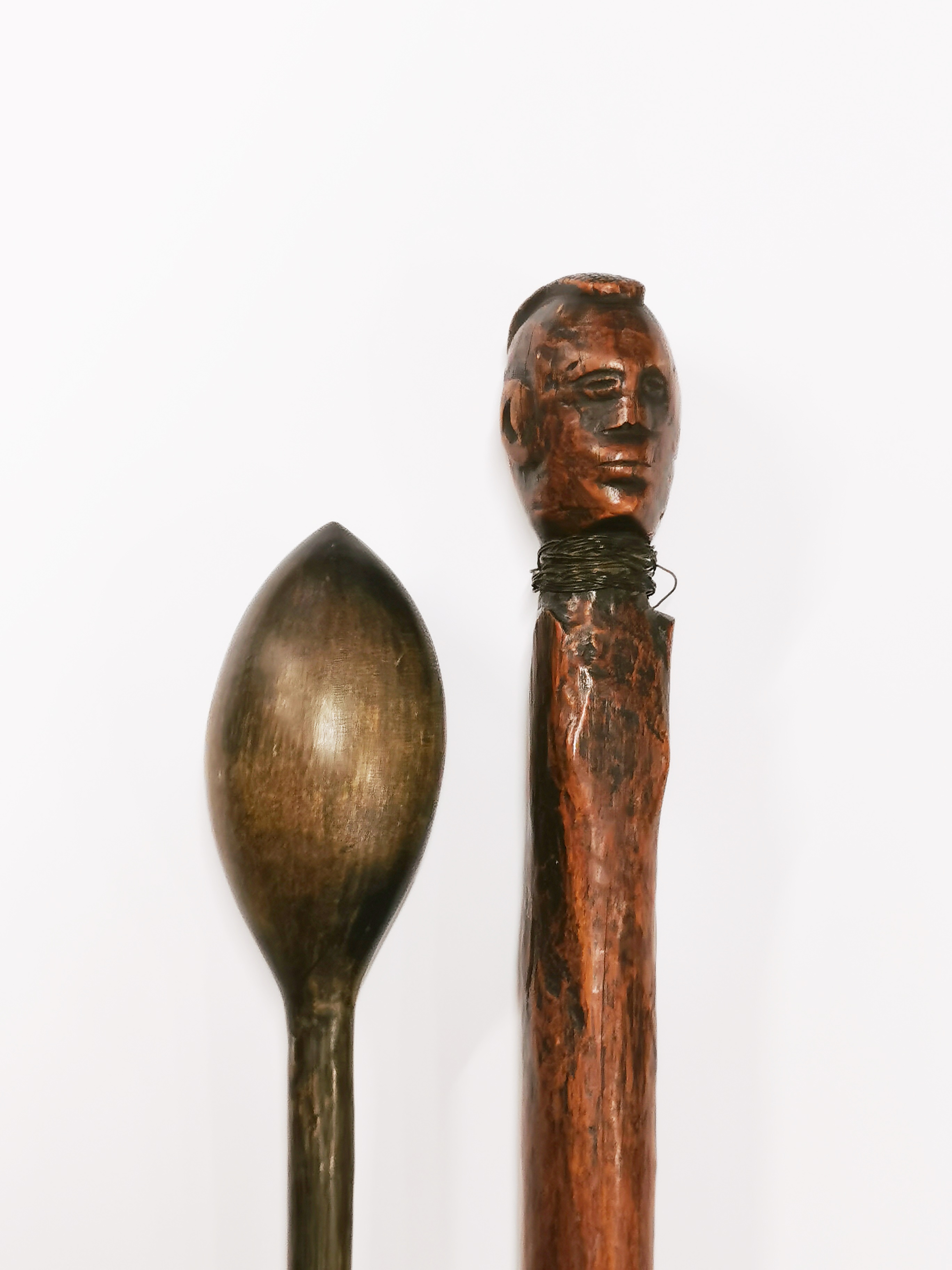 An African carved wooden tribal stick with brass wire binding, L. 68cm. together with a knobkerrie. - Image 2 of 3