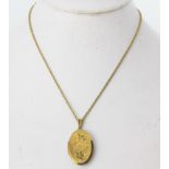 An antique rolled gold locket pendant, L. 3.5cm, on a yellow metal chain, approx. L. 42cm.