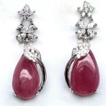 A pair of 925 silver drop earrings set with cabochon cut rubies and white stones, L. 3cm.