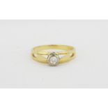 A hallmarked 18ct yellow gold diamond set solitaire ring, (O.5).