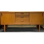 A 1970's teak veneered sideboard, W. 152cm, H. 173cm.