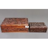 Two carved wooden work boxes, largest 30 x 20 x 10cm.