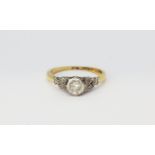 An antique 18ct gold and platinum diamond set solitaire ring, (L).