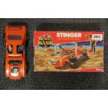 A boxed vintage Stinger toy.