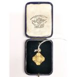A 9ct gold hallmarked early darts fob, engraved for 1933.