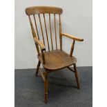 A 19th C elm kitchen chair.