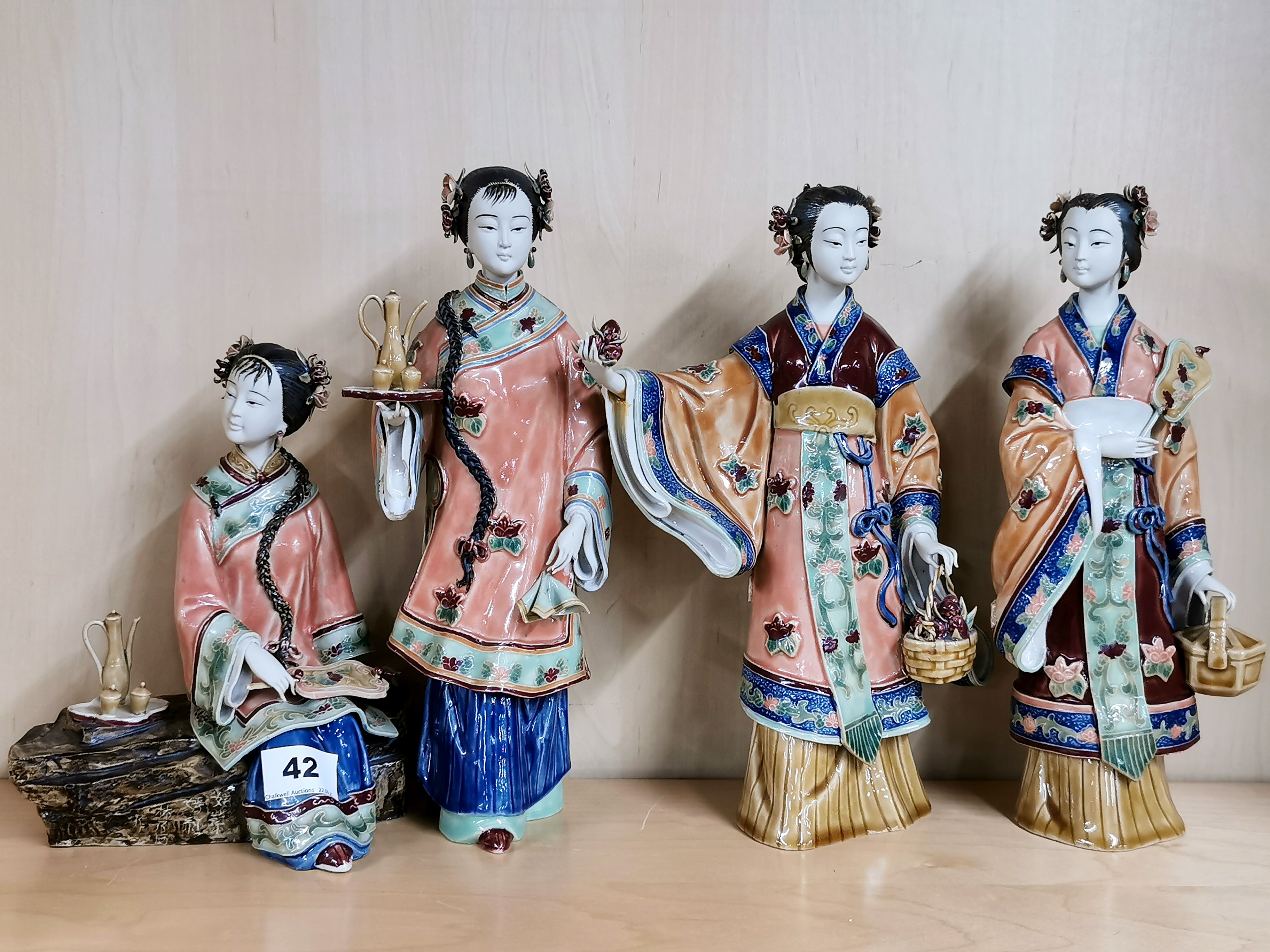 A group of four handmade Chinese porcelain figures of ladies, tallest 29cm.