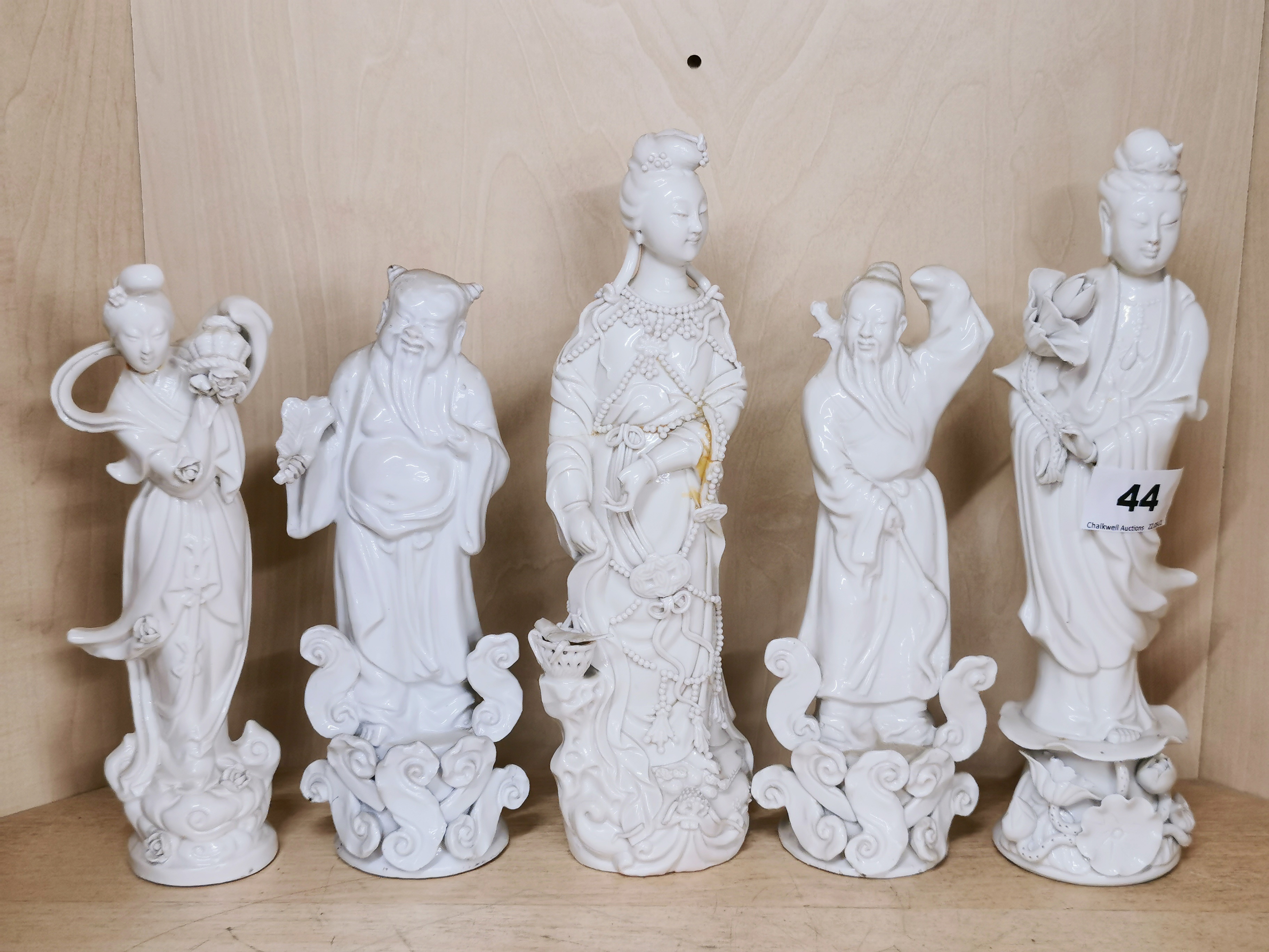 A group of Chinese Blanc de Chine porcelain figures including a deity with loose arms. - Image 5 of 5