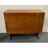 A 1970's teak drop leaf dining table, 91 x 30cm, opening to 136cm.