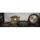 Three vintage clocks and a barometer.