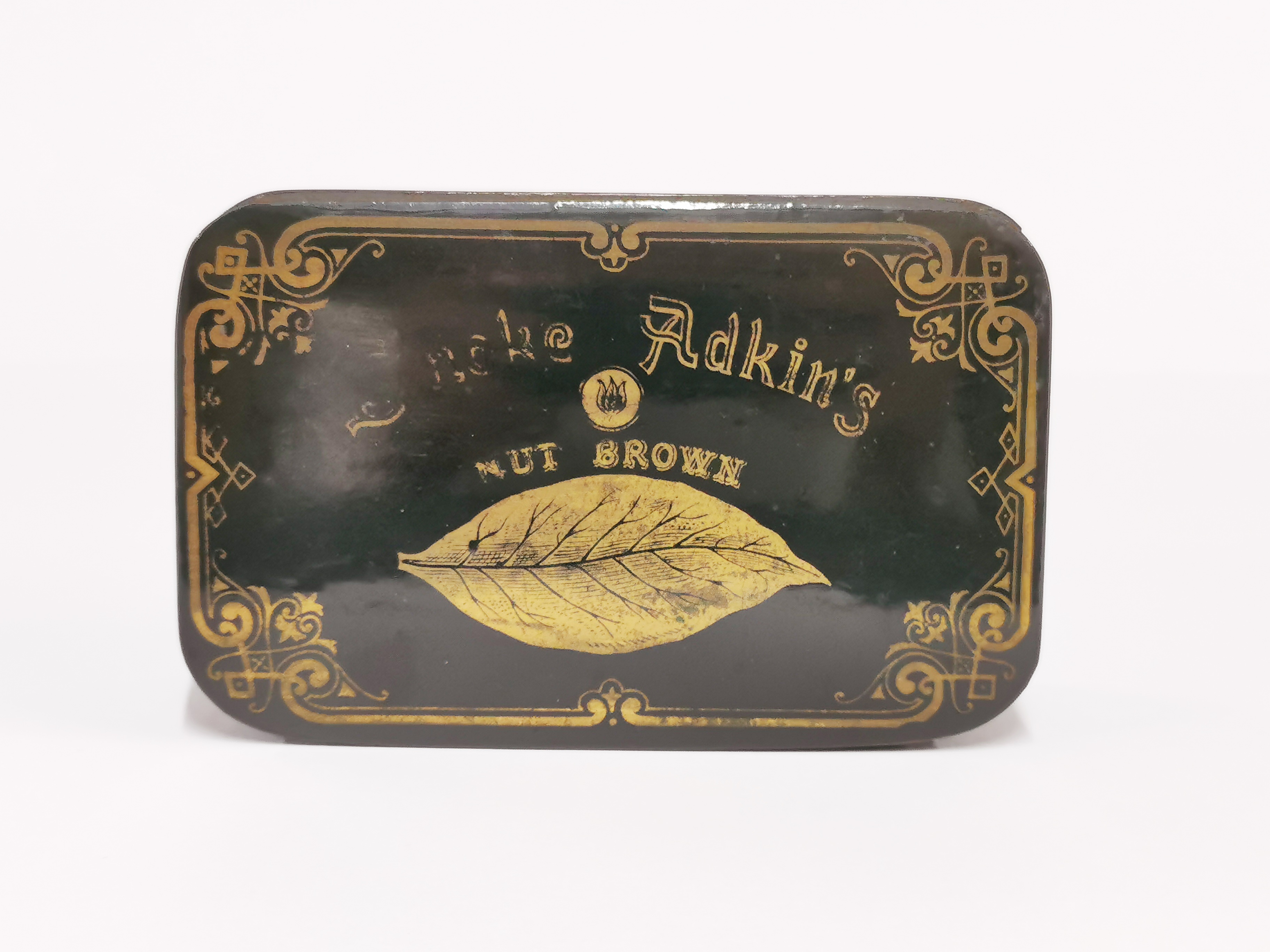 A 19th C papier mache advertising box for Adkin's Nut Brown tobacco, 13 x 8 x 4.5cm.