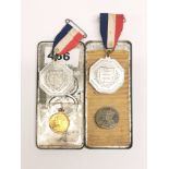 A quantity of royal commerative medals and tin.