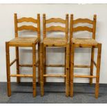 Three vintage pine rush seat bar stools.