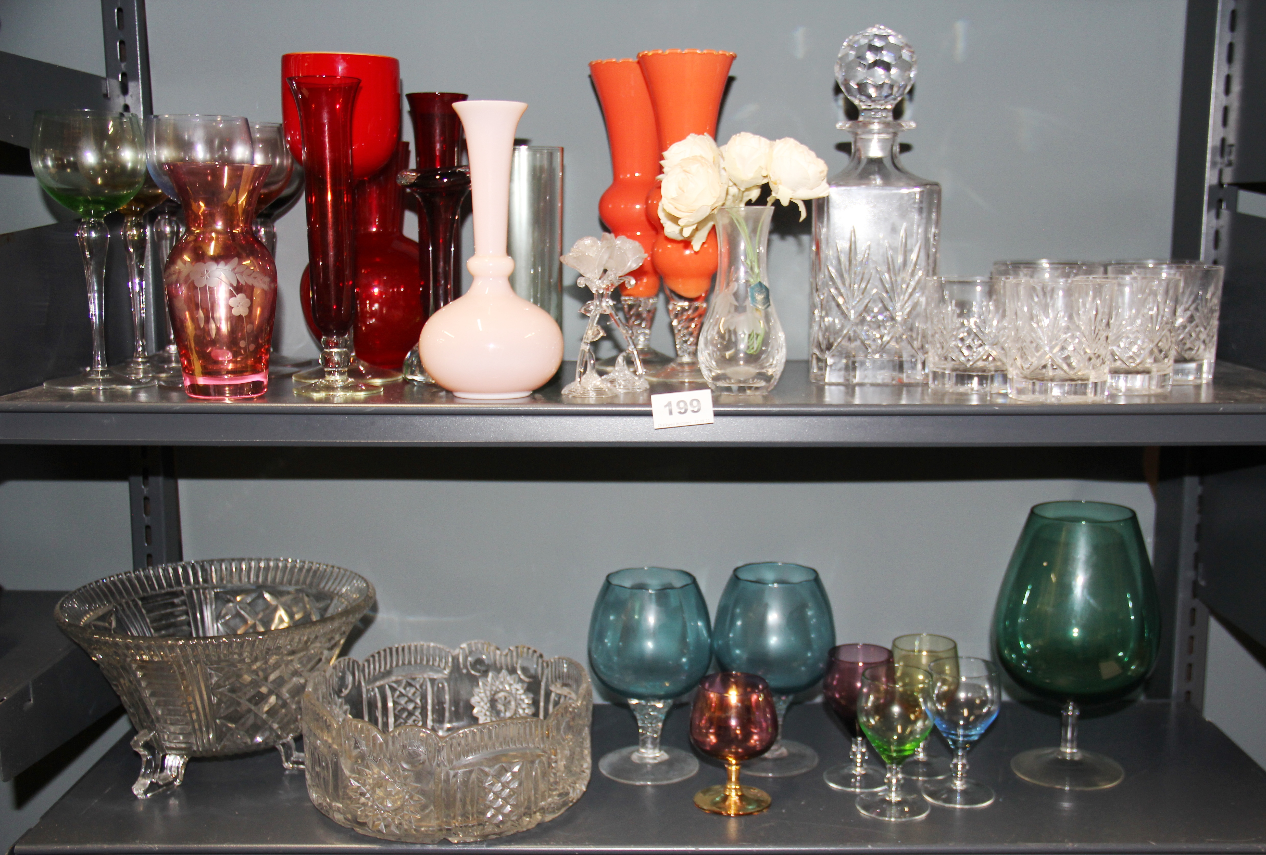 A cut glass decanter, glasses and other items.