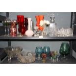 A cut glass decanter, glasses and other items.