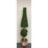 A wood and ceramic tile planter with large artificial topiary, H. 195cm.