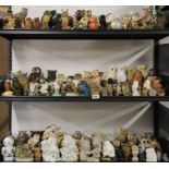 A large collection of ceramic and other owl figures