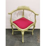 An Edwardian re-upholstered and re-finished corner chair.